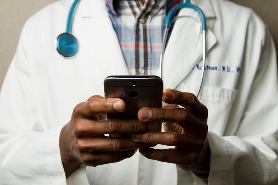 Doctor and front desk coordinating patient care
